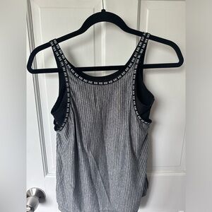 Black/grey/white striped Nike tank top in great condition.